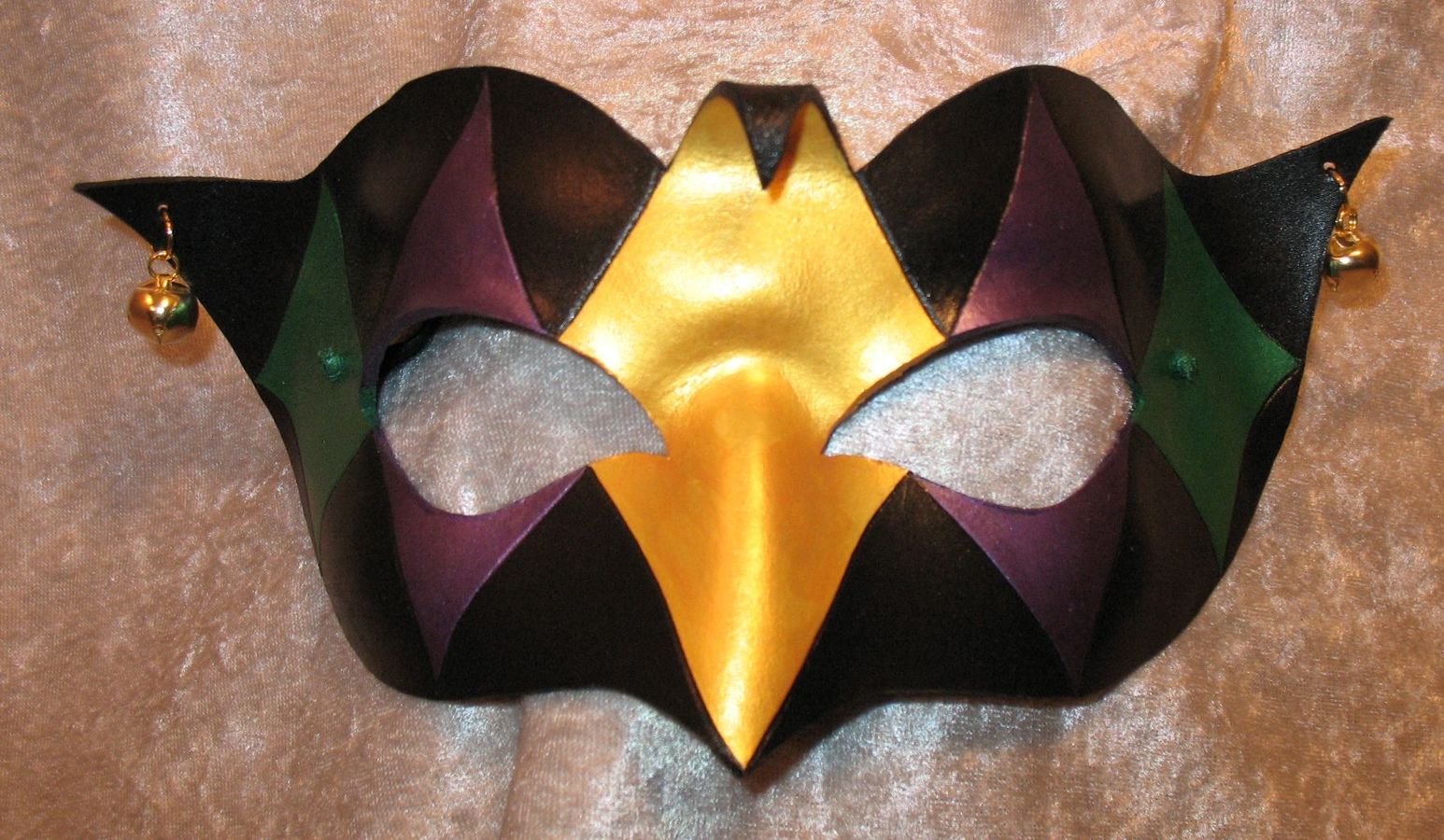 Mardi Gras colored Demure Jester mask.