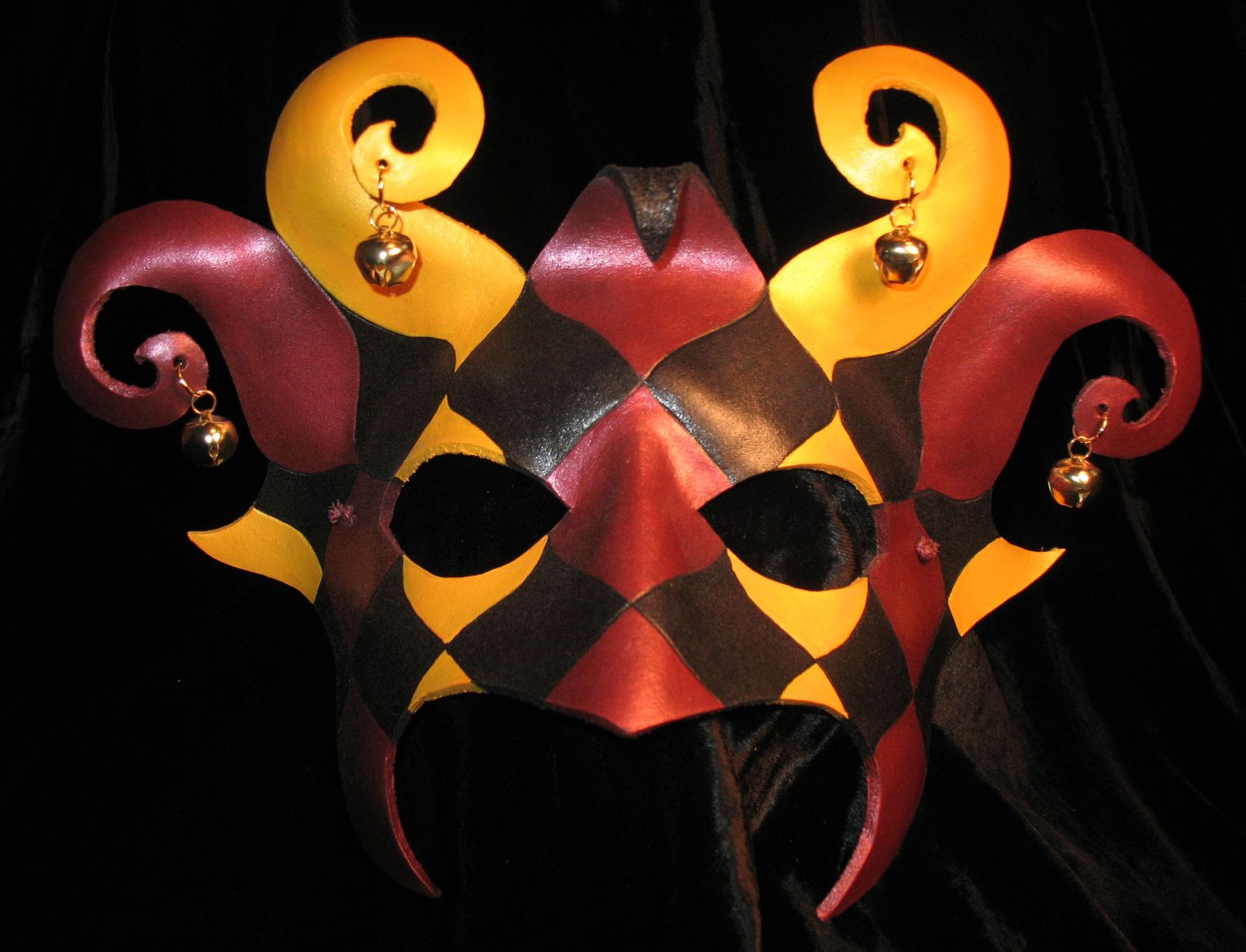 Tri-color red, gold & black Dark Jester mask.